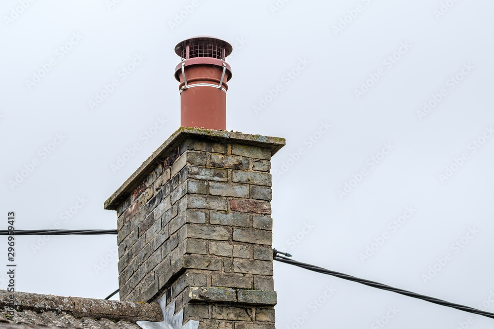 Detailed view of the chimney stack on an old English cottage, showing