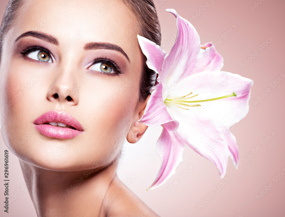 Beauty pure face of the young beautiful girl with flower Beauty pure face of the young beautiful girl with flower