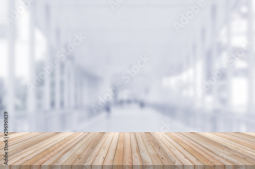wooden table perspective counter front of blur shopping mall background. mock up for montage display product advertise banner.