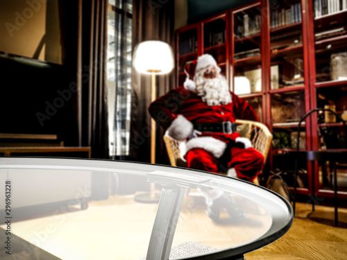 Santa Claus resting in a living room after delivering presents. Comfortable and cozy place in home interior.