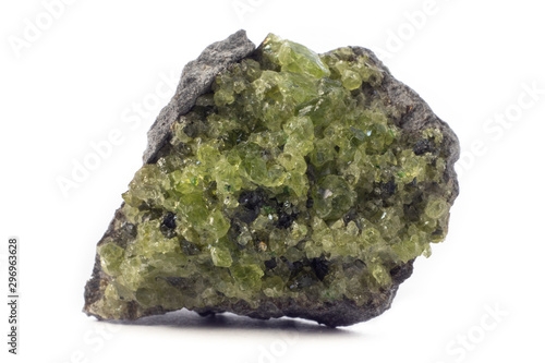 Rock with peridot olivine mineral from the USA isolated on a pure white background.