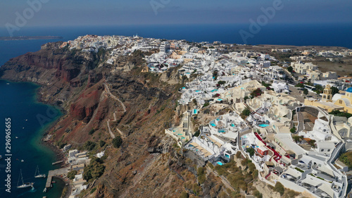 Aerial panoramic photo of iconic village of Oia built on a cliff in famous island of Santorini, Cyclades, Greece
