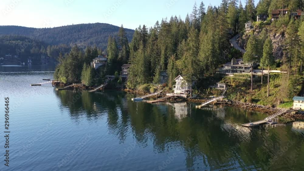 Aerial view over inlet, ocean and island with boat and mountains in beautiful British Columbia. Canada. 4K. Aerial view over inlet, ocean and island with boat and mountains in beautiful British Columbia. Canada. 4K.