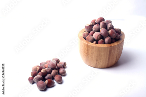 a bowl of filbert isolated on white background