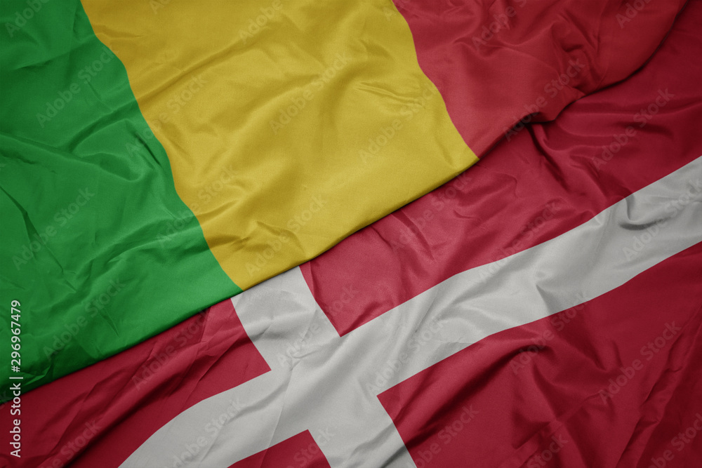 waving colorful flag of denmark and national flag of mali.