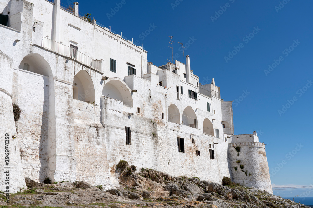 Ostuni, Puglia Italy - April 30, 2019: City of Ostuni, historical center . The White City of Puglia. Mediterranean southern Italy. city wall in Ostuni.
