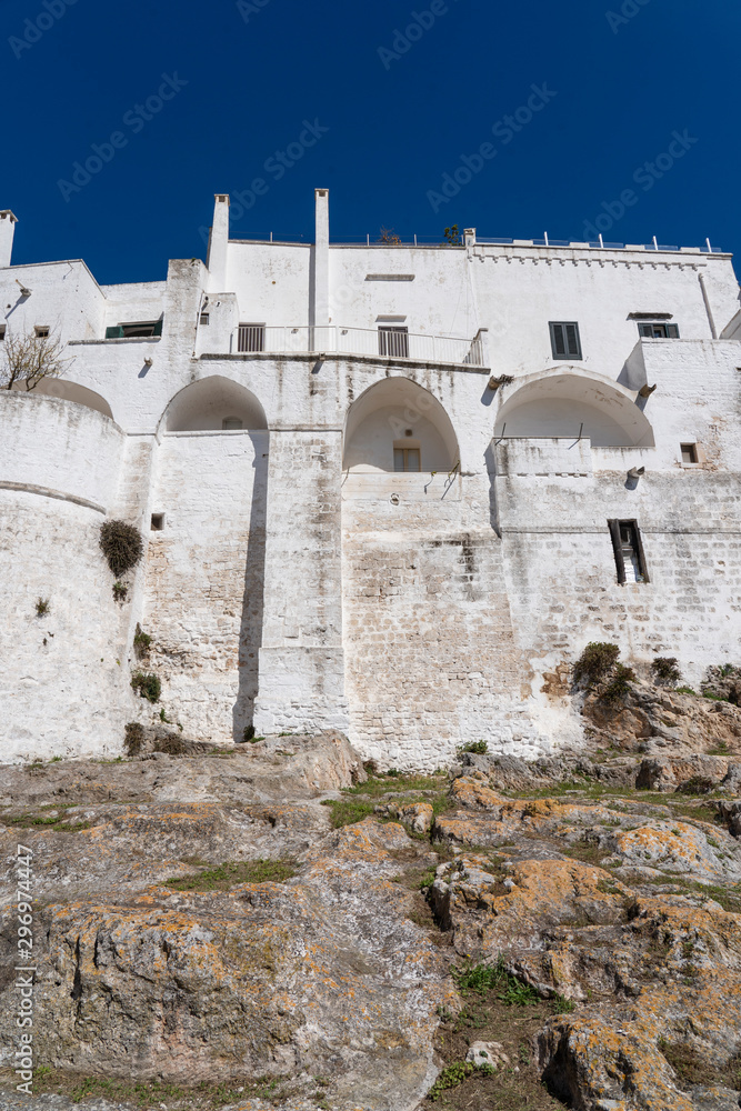 Ostuni, Puglia Italy - April 30, 2019: City of Ostuni, historical center . The White City of Puglia. Mediterranean southern Italy. city wall in Ostuni.
