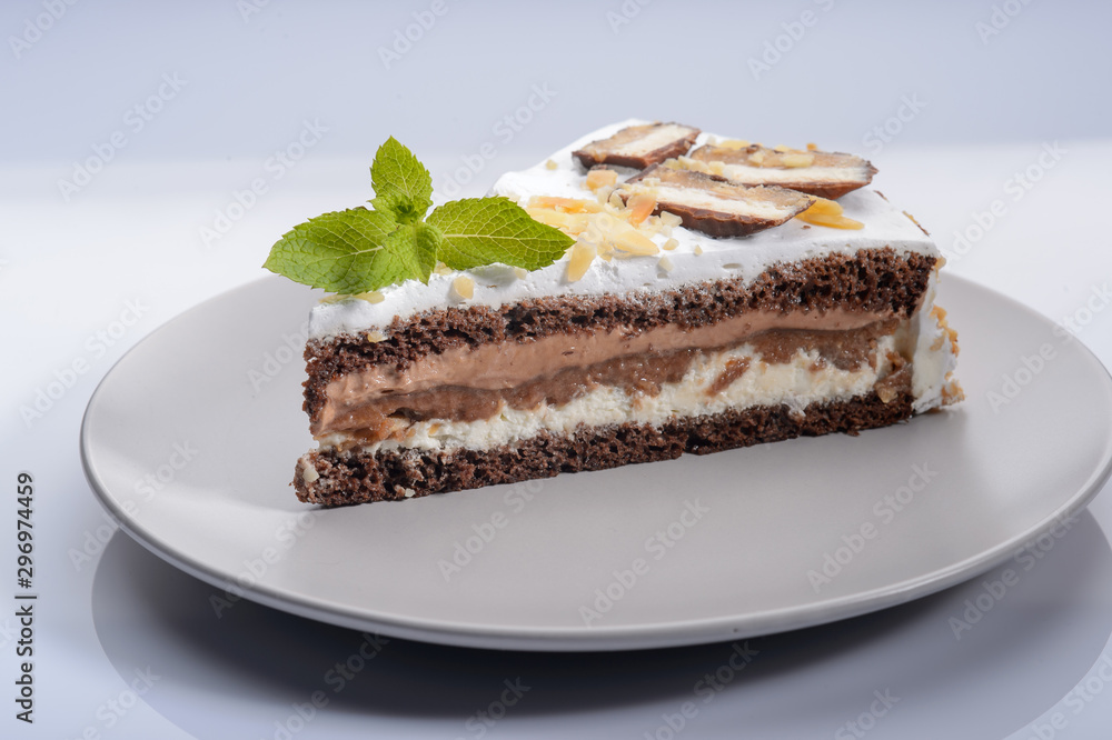 delicious cake with chocolate cream on a gray plate