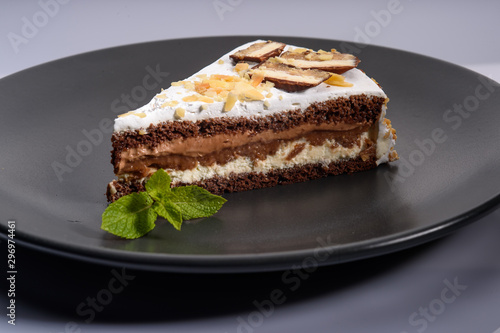 delicious cake with chocolate cream on a black plate10
