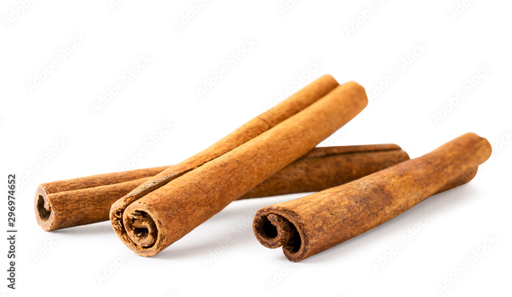 Three cinnamon sticks on a white background, isolated.