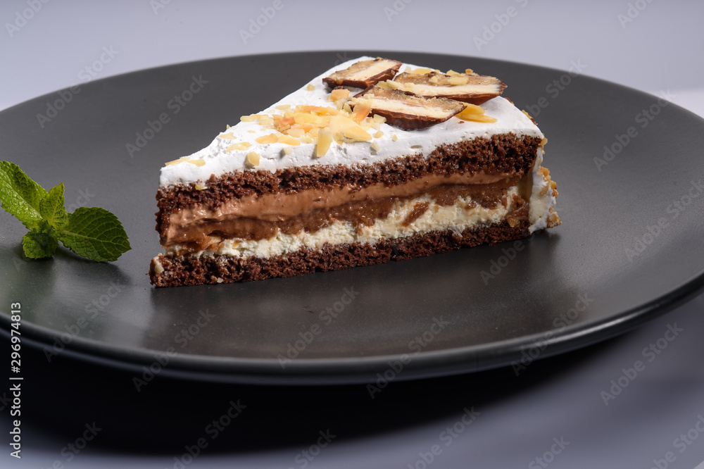 delicious cake with chocolate cream on a black plate5