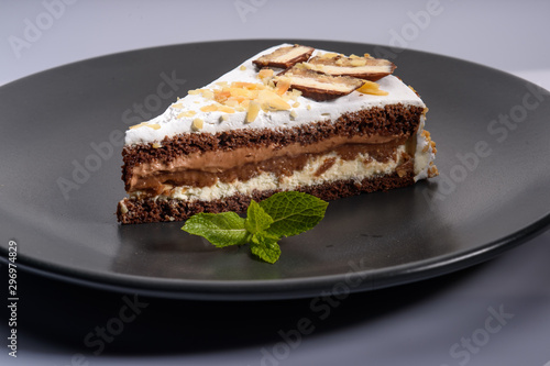 delicious cake with chocolate cream on a black plate4