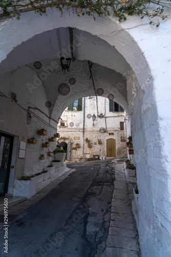 OSTUNI, ITALY - April 30, 2019: touristic trip. Travel view of Ostuni featuring some white houses part of the center of the village, historical center. The image location is Apulia in Italy, Europe. © Ihor