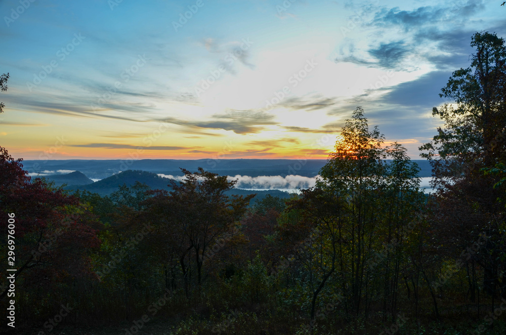 View of the fog covered valley below. Taken from the top of Morrow Mountain State Part NC