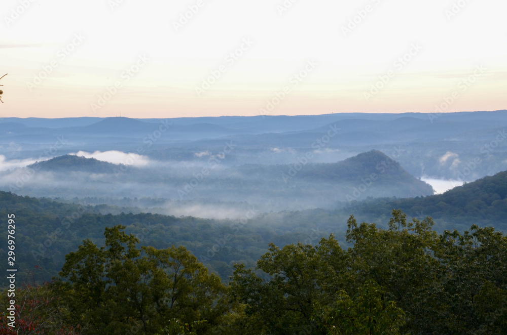 View of the fog covered valley below. Taken from the top of Morrow Mountain State Part NC