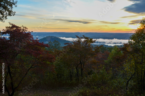 View of the fog covered valley below. Taken from the top of Morrow Mountain State Part NC