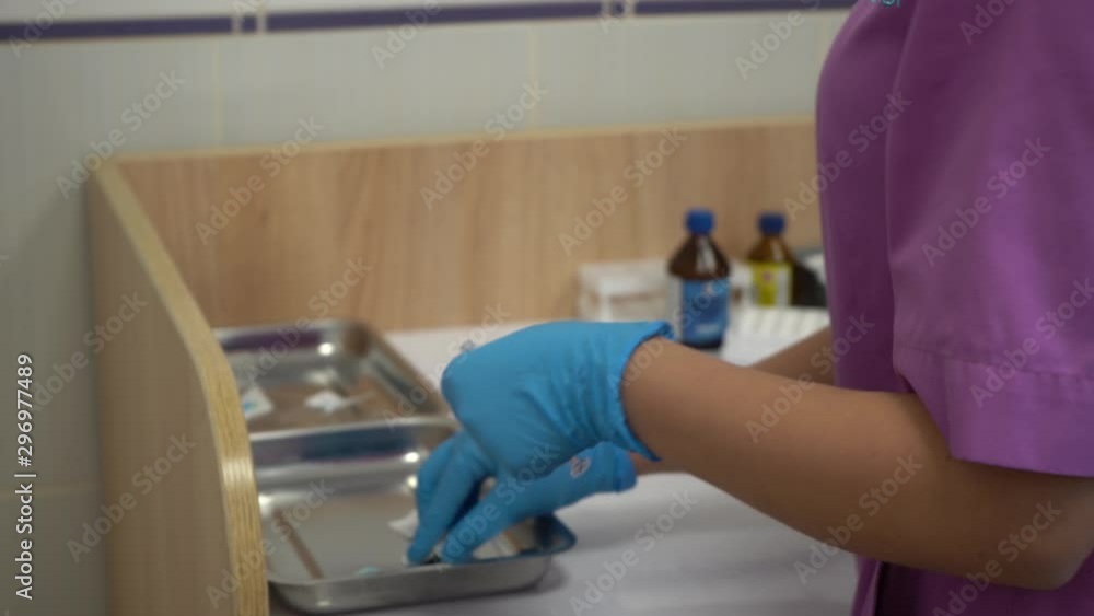 Gloved doctor's hands preparing vaccine for vaccination. Close-up Gloved doctor's hands preparing vaccine for vaccination. Close-up