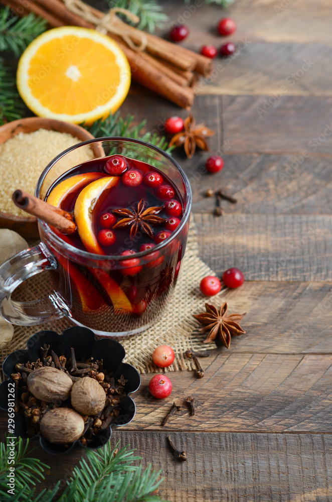 Christmas Mulled Red Wine with Orange, Cranberries and Spices. Holiday Concept. Christmas Mulled Red Wine with Orange, Cranberries and Spices. Holiday Concept.