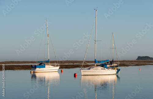 Small sail boats moored at high tide