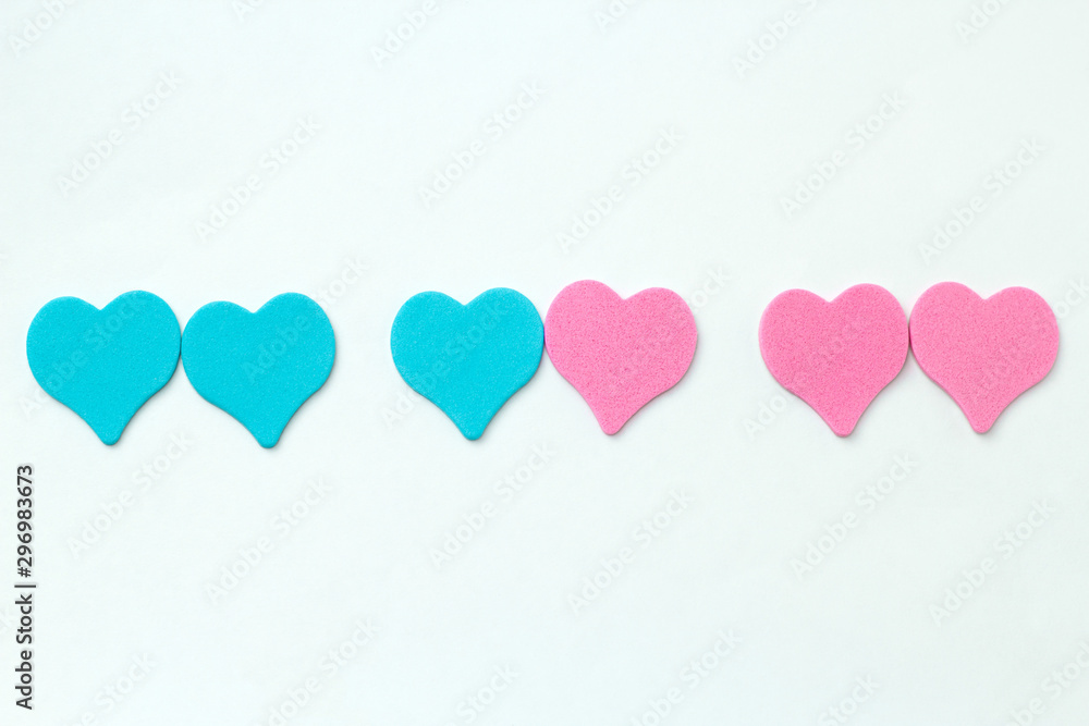 blue and pink hearts on a white background symbol of same sex and heterosexual relationships
