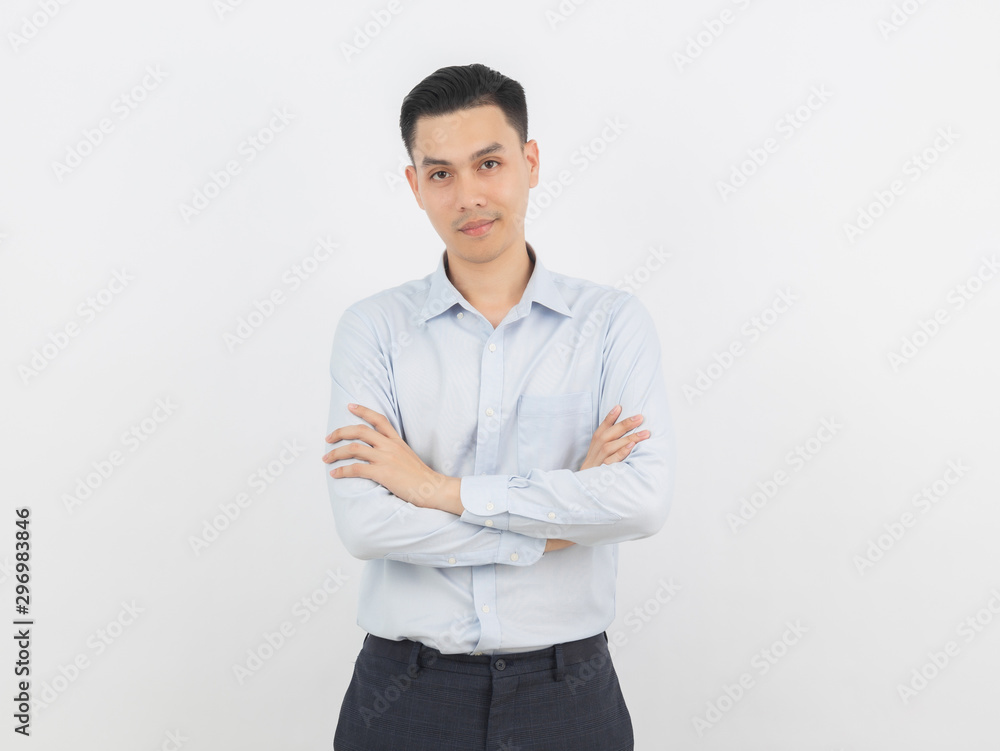 Young handsome asian business man looking to camera with arms crossed isolated on white background. Young handsome asian business man looking to camera with arms crossed isolated on white background.