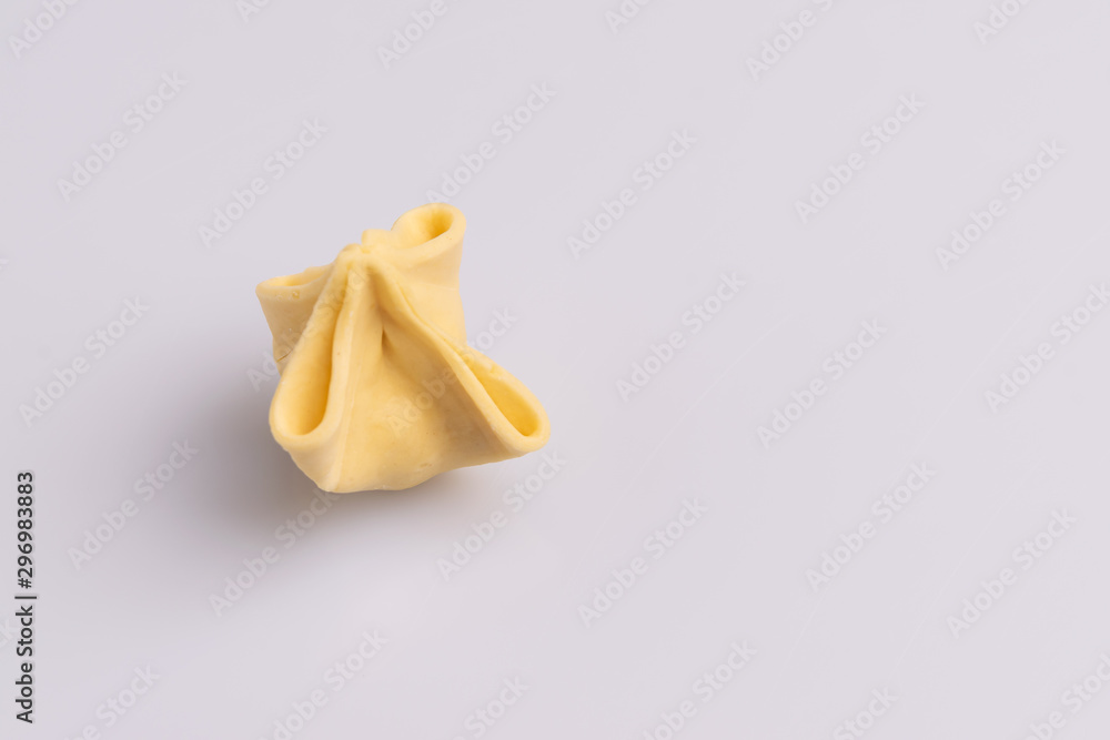 Fagottini Tortellini pasta isolated in white background, soft light, studio photo Fagottini Tortellini pasta isolated in white background, soft light, studio photo