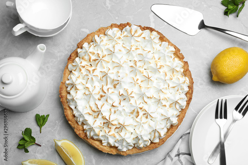 Obraz na płótnie Flat lay composition with delicious lemon meringue pie on grey table
