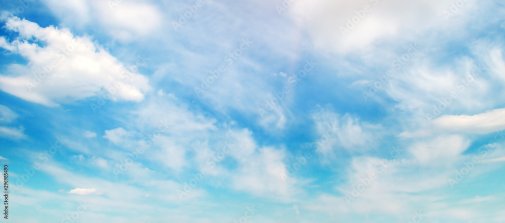 Clouds in the blue sky. Wide photo.