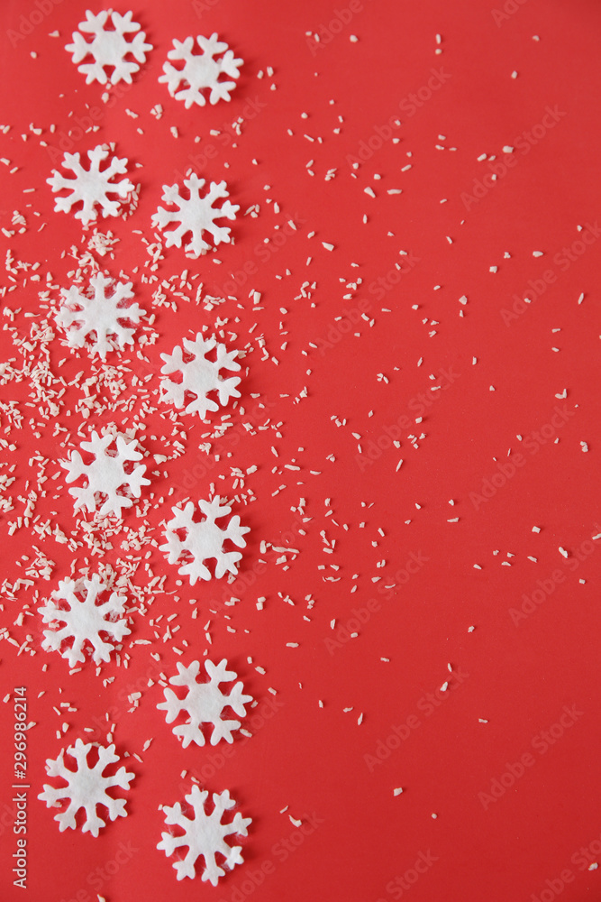 Red christmas background with snowflakes. Christmas and New Year concept. Copy space for text. Pattern, background, postcard, frame. Flat lay. Top view. Vertical photo. Red christmas background with snowflakes. Christmas and New Year concept. Copy space for text. Pattern, background, postcard, frame. Flat lay. Top view. Vertical photo.