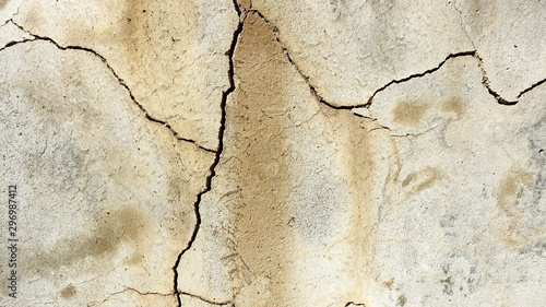  A crack on the concrete wall surface of a house in Los Angeles. Background image for design