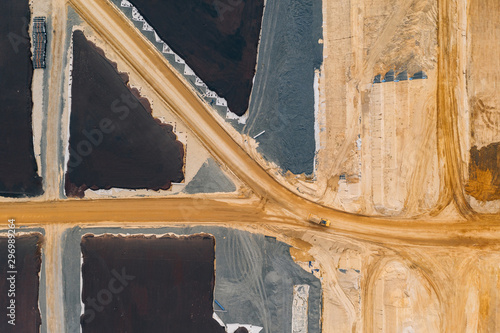 Aerial drone photography of an enormous sand pit construction site. 