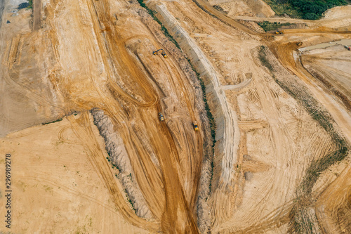 Aerial drone photography of an enormous sand pit construction site. 