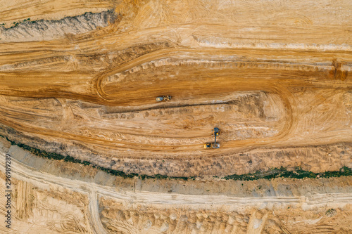 Aerial drone photography of an enormous sand pit construction site. 