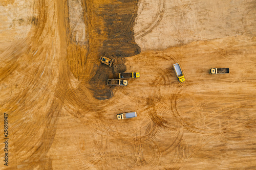 Aerial drone photography of an enormous sand pit construction site. 