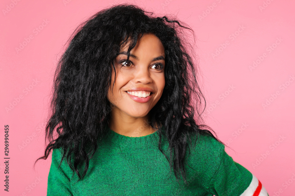 Really?! Surprised African woman in a green sweatshirt with white and red stripes is posing with her eyes wide open, smiling and looking aside. Really?! Surprised African woman in a green sweatshirt with white and red stripes is posing with her eyes wide open, smiling and looking aside.