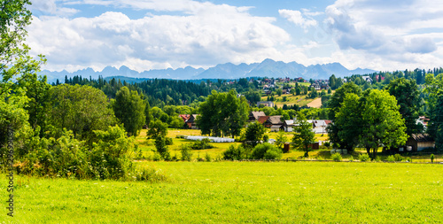 Rural buildings on the background of the Tatra Mountains. Poland.