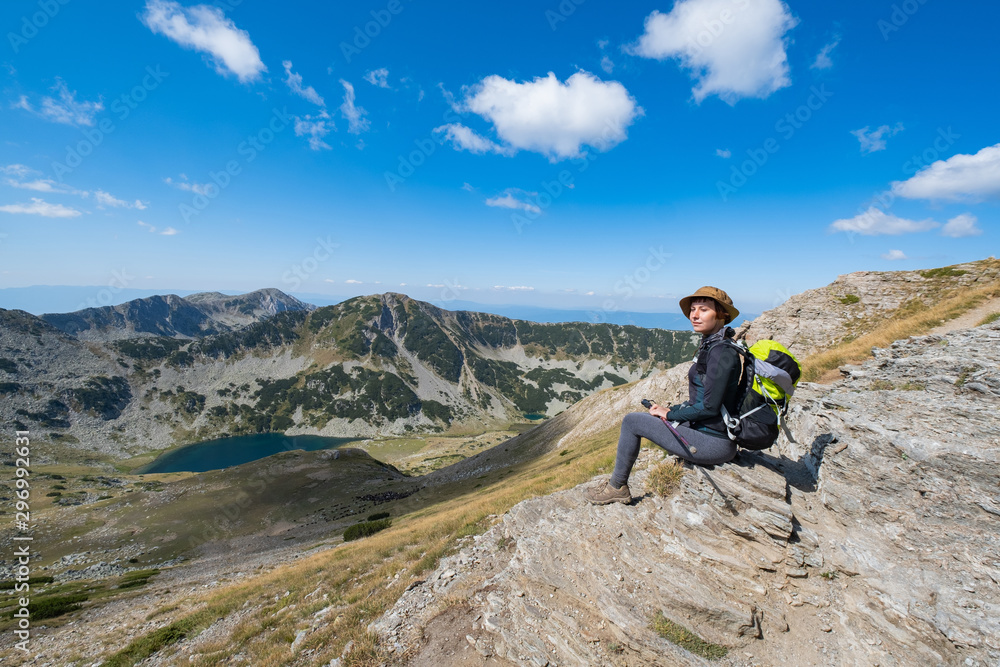 Young woman traveler in the bulgarian mountains , hiking in the sunny day Young woman traveler in the bulgarian mountains , hiking in the sunny day