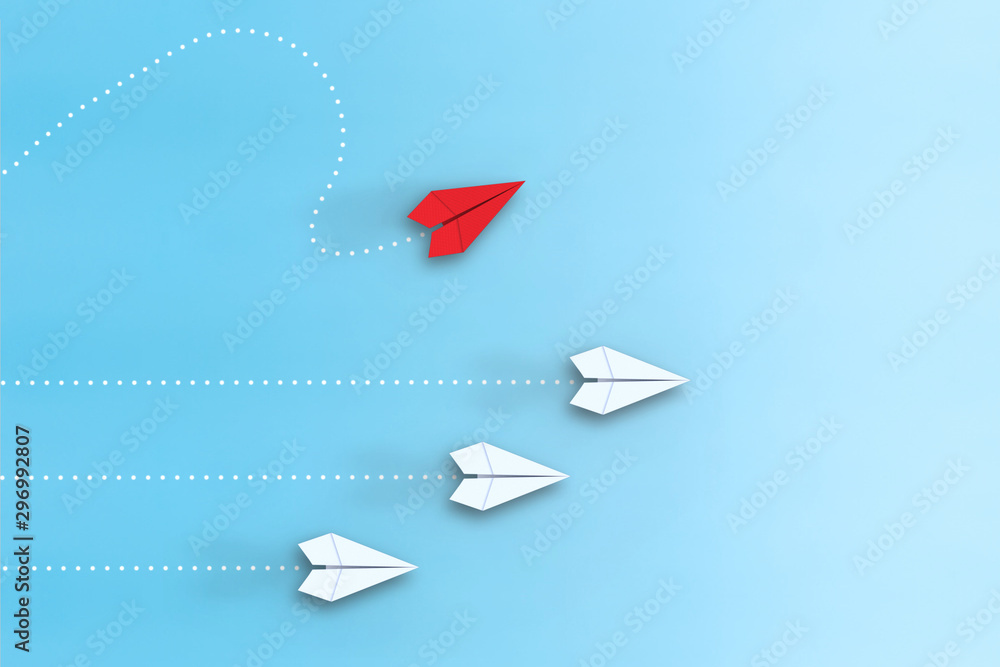 Leadership concept with red paper plane leading among white on blue background - obrazy, fototapety, plakaty 
