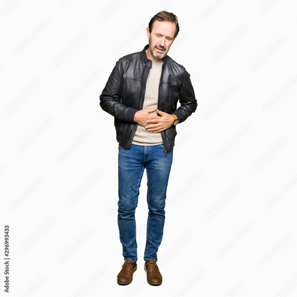 Middle age handsome man wearing black leather jacket with hand on stomach because indigestion, painful illness feeling unwell. Ache concept.