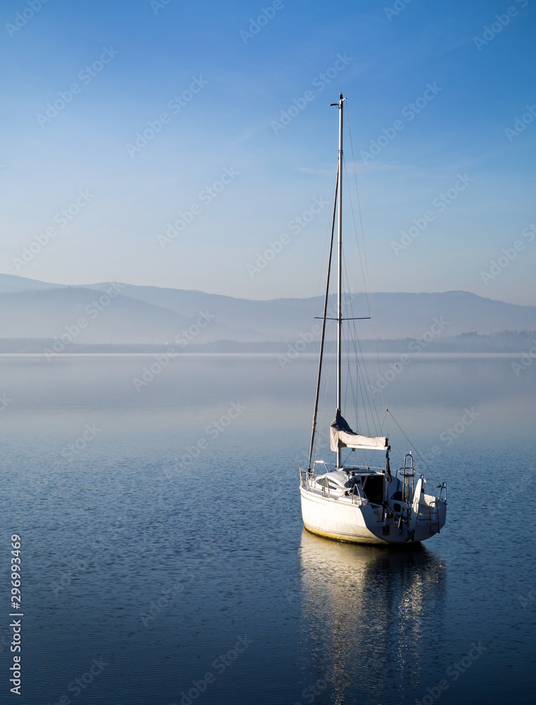 Yacht on the water surface. Reflection Yacht on the water surface. Reflection