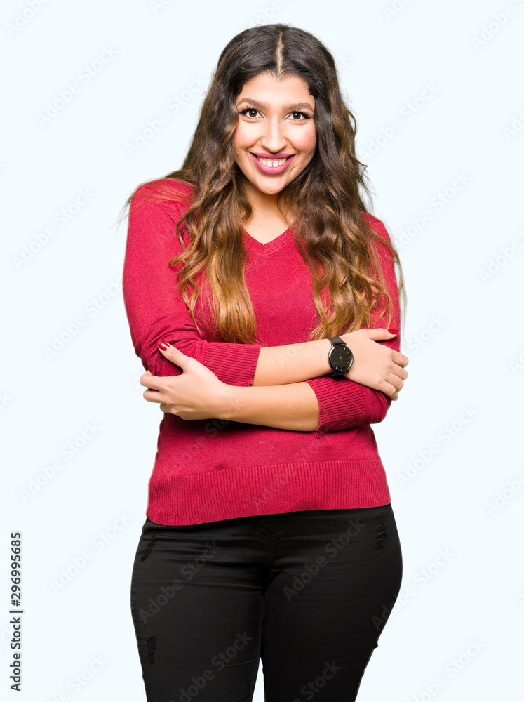 Young beautiful woman wearing red sweater happy face smiling with crossed arms looking at the camera. Positive person. Young beautiful woman wearing red sweater happy face smiling with crossed arms looking at the camera. Positive person.