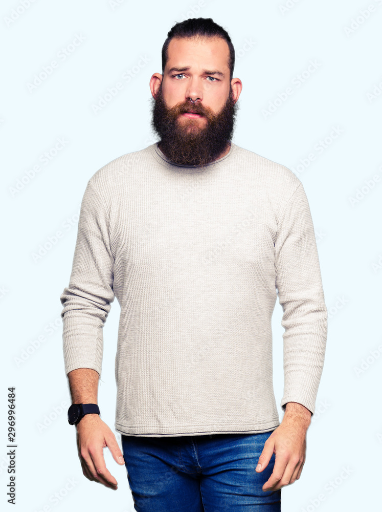 Young blond man wearing casual sweater depressed and worry for distress, crying angry and afraid. Sad expression. Young blond man wearing casual sweater depressed and worry for distress, crying angry and afraid. Sad expression.