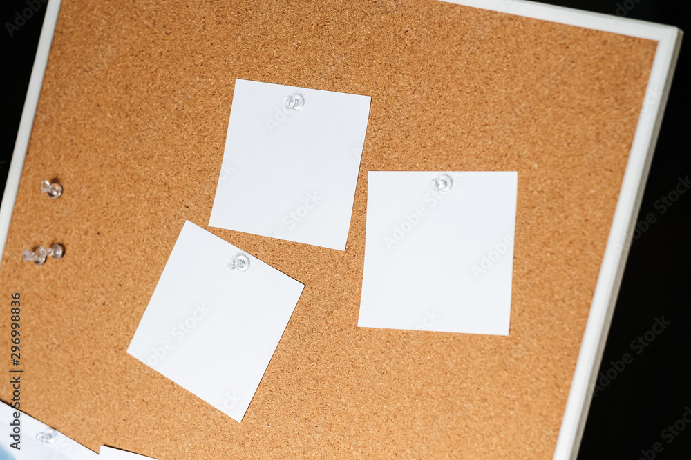 White notes on cork bulletin board White notes on cork bulletin board