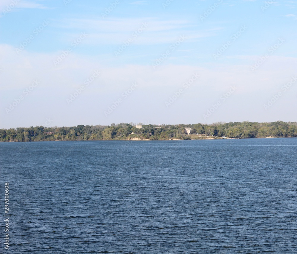 The calm beautiful view of the lake on a sunny day.