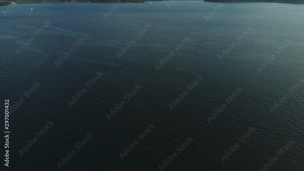 The camera rises from the bottom up from the water to the beautiful tropical Islands. Beautiful view from the sea to the Islands in the distance. Aerial view The camera rises from the bottom up from the water to the beautiful tropical Islands. Beautiful view from the sea to the Islands in the distance. Aerial view