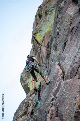 rock climber on top of mountain