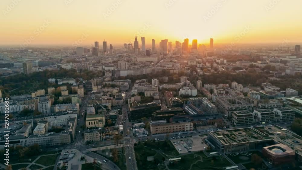 Establishing Aerial Panoramic Shot of Warsaw Cityscape, capital of Poland. Urban Downtown Skyline with Skyscrapers at Golden Sunset. 4K Panning Background Drone Bird's-eye view Video Establishing Aerial Panoramic Shot of Warsaw Cityscape, capital of Poland. Urban Downtown Skyline with Skyscrapers at Golden Sunset. 4K Panning Background Drone Bird's-eye view Video