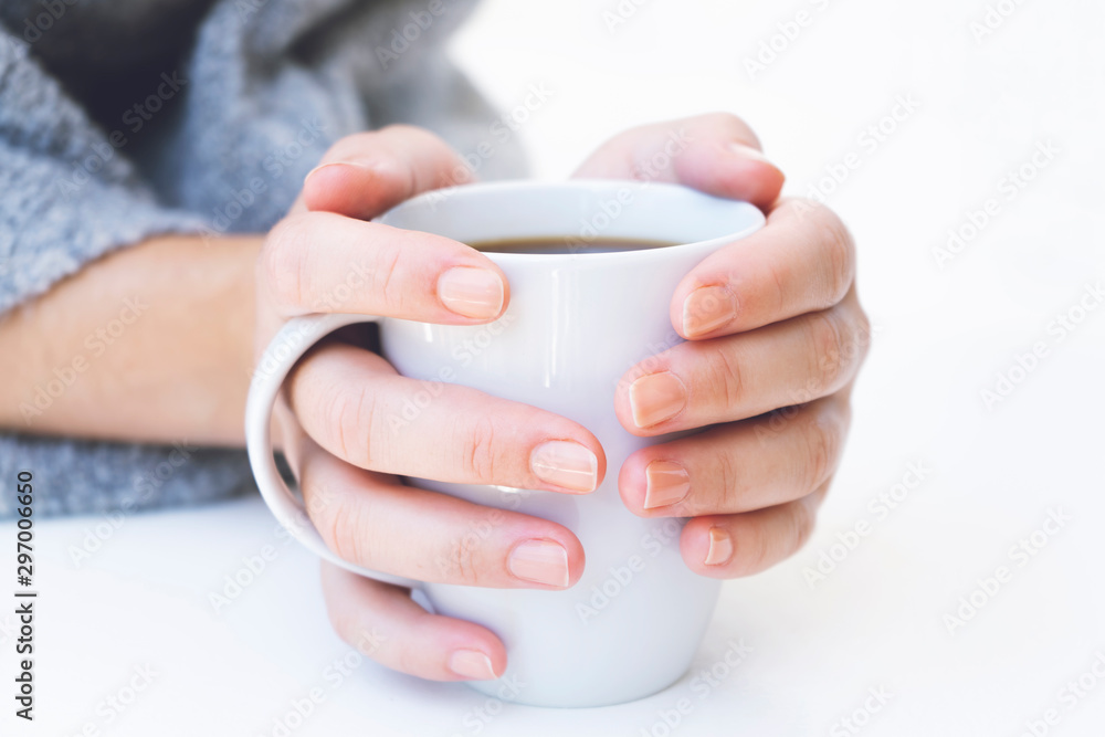 hands holding hot cup of coffee or tea hands holding hot cup of coffee or tea