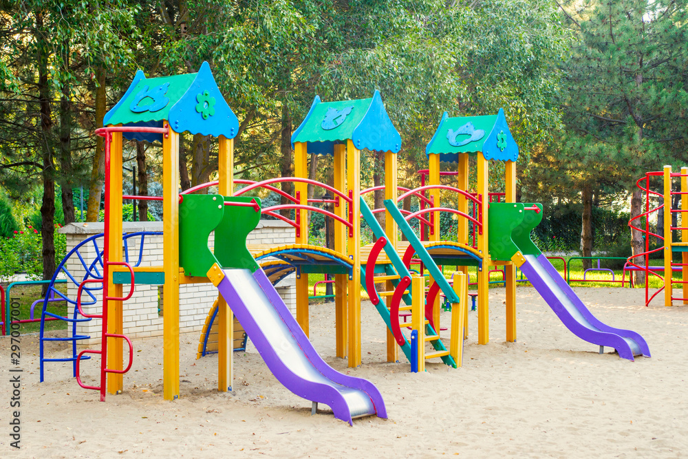 Colorful children playground activities in public park. Safe modern children's playground