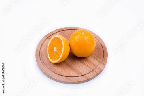 chopped orange on a wooden board photo